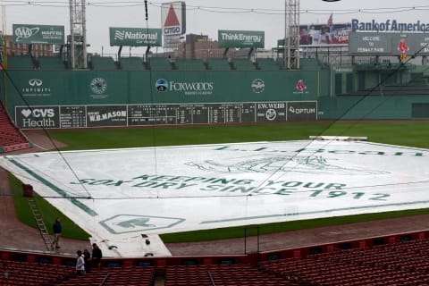 BOSTON, MA – MAY 25: The tarp is pulled over the field prior to the game between the Boston Red Sox and the Texas Rangers at Fenway Park on May 25, 2017 in Boston, Massachusetts. (Photo by Darren McCollester/Getty Images)