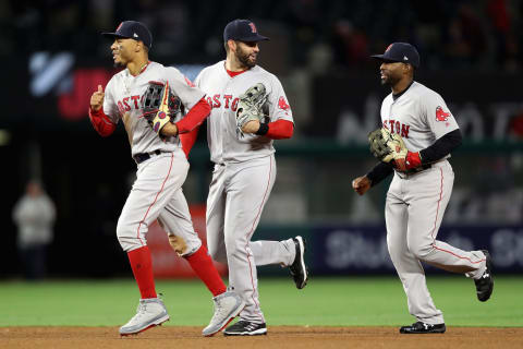 ANAHEIM, CA – APRIL 18: Mookie Betts #50, J.D. Martinez #28 and Jackie Bradley Jr. #19 of the Boston Red Sox celebrate as they run off the field after defeating the Los Angeles Angels of Anaheim 9-0 in a game at Angel Stadium on April 18, 2018 in Anaheim, California. (Photo by Sean M. Haffey/Getty Images)