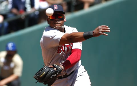 ARLINGTON, TX – MAY 6: Rafael Devers #11 of the Boston Red Sox throws to first base after fielding a ball off the bat of Ronald Guzman of the Texas Rangers during the second inning at Globe Life Park in Arlington on May 6, 2018 in Arlington, Texas. (Photo by Ron Jenkins/Getty Images)