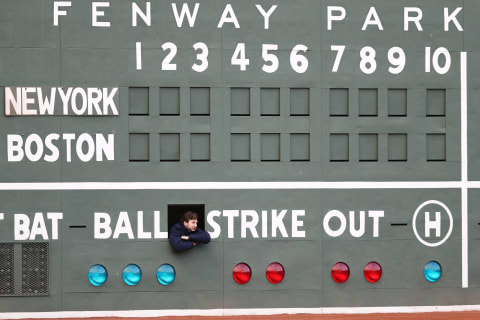 BOSTON, MA – APRIL 11: A scorekeeper looks on from inside the Green Monster before the game between the Boston Red Sox and the New York Yankees at Fenway Park on April 11, 2018 in Boston, Massachusetts. (Photo by Maddie Meyer/Getty Images)