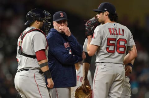 MINNEAPOLIS, MN – JUNE 19: Pitching coach Dana LeVangie #60 of the Boston Red Sox speaks to Sandy Leon #3 and Joe Kelly #56 on the mound during the eighth inning of the game against the Minnesota Twins on June 19, 2018 at Target Field in Minneapolis, Minnesota. The Twins defeated the Red Sox 6-2. (Photo by Hannah Foslien/Getty Images)