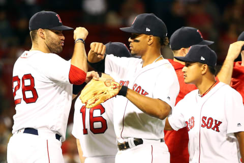 BOSTON, MA – JUNE 26: J.D. Martinez #28 of the Boston Red Sox high fives Xander Bogaerts #2 of the Boston Red Sox after a victory over the Los Angeles Angels at Fenway Park on June 26, 2018 in Boston, Massachusetts. (Photo by Adam Glanzman/Getty Images)