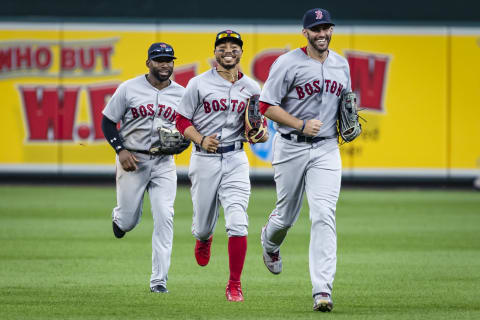 BALTIMORE, MD – AUGUST 12: Jackie Bradley Jr. #19, Mookie Betts #50, and J.D. Martinez #28 of the Boston Red Sox celebrate after the game at Oriole Park at Camden Yards on August 12, 2018 in Baltimore, Maryland. Red Sox won 4-1. (Photo by Scott Taetsch/Getty Images)