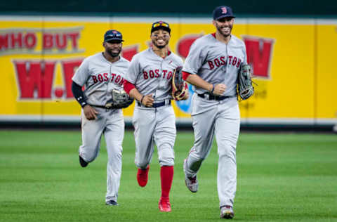 BALTIMORE, MD – AUGUST 12: Jackie Bradley Jr. #19, Mookie Betts #50, and J.D. Martinez #28 of the Boston Red Sox celebrate after the game at Oriole Park at Camden Yards on August 12, 2018 in Baltimore, Maryland. Red Sox won 4-1. (Photo by Scott Taetsch/Getty Images)