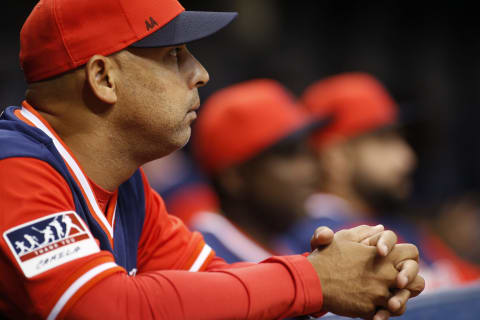 ST. PETERSBURG, FL – AUGUST 24: Manager Alex Cora #20 of the Boston Red Sox looks on from the dugout during the third inning of a game against the Tampa Bay Rays on August 24, 2018 at Tropicana Field in St. Petersburg, Florida. All players across MLB will wear nicknames on their backs as well as colorful, non-traditional uniforms featuring alternate designs inspired by youth-league uniforms. (Photo by Brian Blanco/Getty Images)