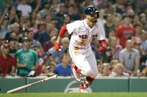 BOSTON, MA – AUGUST 29: Mookie Betts #50 of the Boston Red Sox drives in two runs for the lead with a double against the Miami Marlins in the seventh inning at Fenway Park on August 29, 2018 in Boston, Massachusetts. (Photo by Jim Rogash/Getty Images)