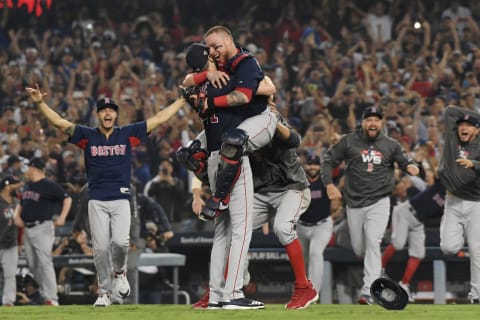 LOS ANGELES, CA – OCTOBER 28: Christian Vazquez #7 jumps into the arms of Chris Sale #41 of the Boston Red Sox to celebrate their 5-1 win over the Los Angeles Dodgers in Game Five to win the 2018 World Series at Dodger Stadium on October 28, 2018 in Los Angeles, California. (Photo by Harry How/Getty Images)