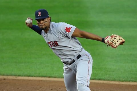 Red Sox shortstop Xander Bogaerts makes a throw. (Photo by Mike Stobe/Getty Images)