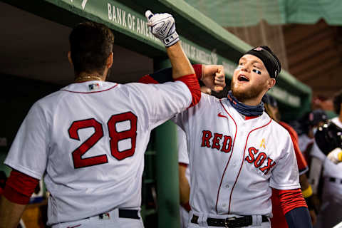 BOSTON, MA – SEPTEMBER 5: J.D. Martinez #28 of the Boston Red Sox high fives Alex Verdugo #99 after hitting a solo home run during the second inning of a game against the Toronto Blue Jays on September 5, 2020 at Fenway Park in Boston, Massachusetts. The 2020 season had been postponed since March due to the COVID-19 pandemic. (Photo by Billie Weiss/Boston Red Sox/Getty Images)