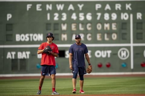 BOSTON, MA – JULY 22: Boston Red Sox 2021 first round draft pick Marcelo Mayer reacts with Xander Bogaerts #2 of the Boston Red Sox as he takes ground balls after signing a contract with the club on July 22, 2021 at Fenway Park in Boston, Massachusetts. (Photo by Billie Weiss/Boston Red Sox/Getty Images)