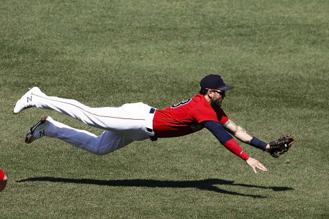 BOSTON, MA – JULY 28: Michael Chavis #23 of the Boston Red Sox makes a diving catch on Vladimir Guerrero Jr. #27 of the Toronto Blue Jays during the third inning of the first game of a doubleheader at Fenway Park on July 28, 2021 in Boston, Massachusetts. (Photo By Winslow Townson/Getty Images)