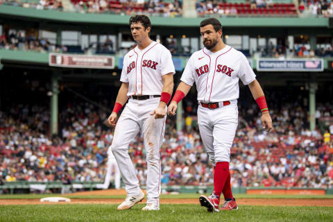 BOSTON, MA – SEPTEMBER 5: Bobby Dalbec #29 and Kyle Schwarber #18 of the Boston Red Sox walk off the field during the fourth inning of a game against the Cleveland Indians on September 5, 2021 at Fenway Park in Boston, Massachusetts. (Photo by Billie Weiss/Boston Red Sox/Getty Images)