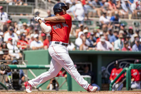 FT. MYERS, FL – MARCH 26: Rafael Devers #11 of the Boston Red Sox hits a solo home run during the first inning of a Grapefruit League game against the Tampa Bay Rays on March 26, 2022 at jetBlue Park at Fenway South in Fort Myers, Florida. (Photo by Billie Weiss/Boston Red Sox/Getty Images)