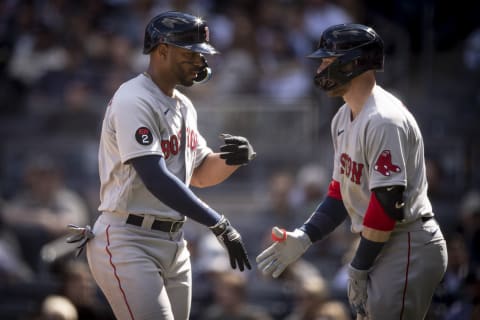 NEW YORK, NY – APRIL 8: Xander Bogaerts #2 of the Boston Red Sox reacts with Trevor Story #10 of the Boston Red Sox after scoring during the sixth inning of the 2022 Major League Baseball Opening Day game against the New York Yankees on April 8, 2022 at Yankee Stadium in the Bronx borough of New York City. (Photo by Maddie Malhotra/Boston Red Sox/Getty Images)