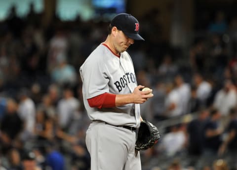 NEW YORK, NY – SEPTEMBER 25: John Lackey #41 of the Boston Red Sox reacts after allowing a two-run double to Mark Teixeira #25 of the New York Yankees during the bottom of the first inning on September 25, 2011 at Yankee Stadium in the Bronx borough of New York City. (Photo by Christopher Pasatieri/Getty Images)