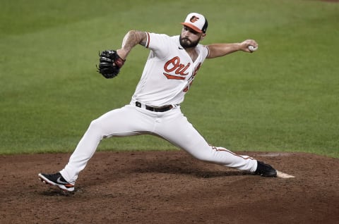 BALTIMORE, MARYLAND – AUGUST 25: Tanner Scott #66 of the Baltimore Orioles pitches against the Los Angeles Angels at Oriole Park at Camden Yards on August 25, 2021 in Baltimore, Maryland. (Photo by G Fiume/Getty Images)