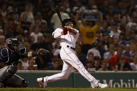 BOSTON, MA – AUGUST 11: Jarren Duran #40 of the Boston Red Sox follows through on a hit against the Tampa Bay Rays during the fifth inning at Fenway Park on August 11, 2021 in Boston, Massachusetts. (Photo By Winslow Townson/Getty Images)