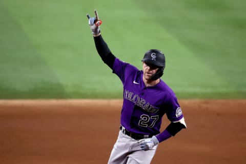 ARLINGTON, TEXAS – AUGUST 30: Trevor Story #27 of the Colorado Rockies celebrates after hitting a two-run home run against the Texas Rangers in the top of the eighth inning at Globe Life Field on August 30, 2021 in Arlington, Texas. (Photo by Tom Pennington/Getty Images)