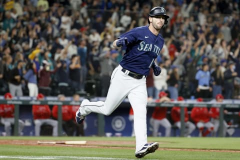 SEATTLE, WASHINGTON – OCTOBER 02: Mitch Haniger #17 of the Seattle Mariners reacts after his two-run home run during the fifth inning against the Los Angeles Angels at T-Mobile Park on October 02, 2021 in Seattle, Washington. (Photo by Steph Chambers/Getty Images)