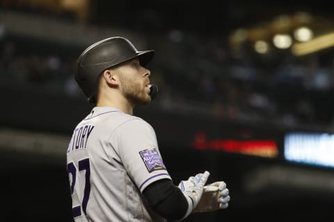 PHOENIX, ARIZONA – OCTOBER 02: Trevor Story #27 of the Colorado Rockies adjusts his gloves during the game against the Arizona Diamondbacks at Chase Field on October 02, 2021 in Phoenix, Arizona. (Photo by Chris Coduto/Getty Images)