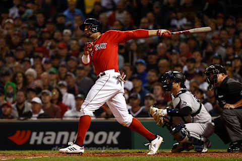 BOSTON, MA – OCTOBER 6: Xander Bogaerts #2 of the Boston Red Sox follows through on a home run against the New York Yankees during the AL Wild Card playoff game at Fenway Park on October 6, 2021 in Boston, Massachusetts. (Photo By Winslow Townson/Getty Images)