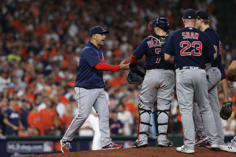 HOUSTON, TEXAS – OCTOBER 22: Manager Alex Cora #13 of the Boston Red Sox removes Tanner Houck #89 from the game against the Houston Astros during the eighth inning in Game Six of the American League Championship Series at Minute Maid Park on October 22, 2021 in Houston, Texas. (Photo by Elsa/Getty Images)