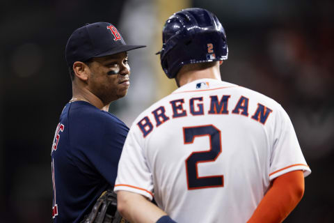 HOUSTON, TX – OCTOBER 22: Rafael Devers #11 of the Boston Red Sox reacts with Alex Bregman #2 of the Houston Astros during the fourth inning of game six of the 2021 American League Championship Series at Minute Maid Park on October 22, 2021 in Houston, Texas. (Photo by Billie Weiss/Boston Red Sox/Getty Images)