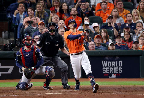 HOUSTON, TEXAS – OCTOBER 27: Carlos Correa #1 of the Houston Astros flies out against the Atlanta Braves during the seventh inning in Game Two of the World Series at Minute Maid Park on October 27, 2021 in Houston, Texas. (Photo by Elsa/Getty Images)