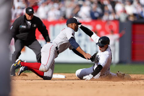 NEW YORK, NEW YORK – APRIL 09: Joey Gallo #13 of the New York Yankees is tagged out at second base by Xander Bogaerts #2 of the Boston Red at Yankee Stadium during the second inning of the game on April 09, 2022 in New York City. (Photo by Dustin Satloff/Getty Images)