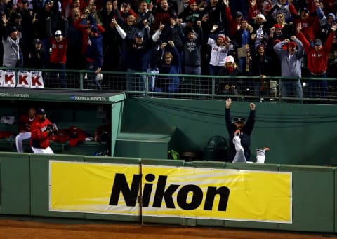 BOSTON, MA – OCTOBER 13: Boston police officer Steve Horgan reacts as Torii Hunter #48 of the Detroit Tigers tries to catch a grand slam hit by David Ortiz #34 of the Boston Red Sox in the eighth inning of Game Two of the American League Championship Series at Fenway Park on October 13, 2013 in Boston, Massachusetts. (Photo by Al Bello/Getty Images)