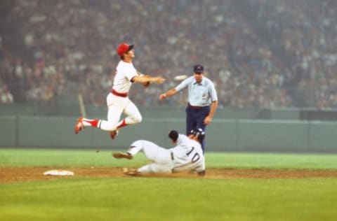 BOSTON, MA – CIRCA 1976: Rick Burleson #7 of the Boston Red Sox completes the double-play over Chris Chambliss #10 of the New York Yankees during an Major League Baseball game circa 1976 at Fenway Park in Boston, Massachusetts. Burleson played for the Red Sox from 1974-80. (Photo by Focus on Sport/Getty Images)