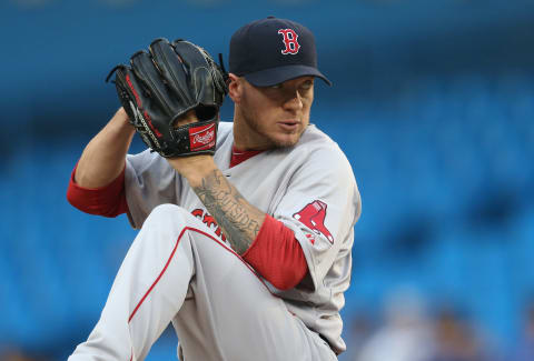 TORONTO, CANADA – JULY 22: Jake Peavy #44 of the Boston Red Sox delivers a pitch during MLB game action against the Toronto Blue Jays on July 22, 2014 at Rogers Centre in Toronto, Ontario, Canada. (Photo by Tom Szczerbowski/Getty Images)