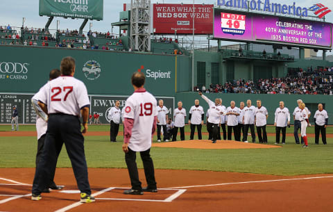 BOSTON, MA – MAY 5: Luis Tiant throws to MLB Hall of Famer Carlton Fisk during a celebration of the 1975 American League Champions before a game between Boston Red Sox and Tampa Bay Rays at Fenway Park May 5, 2015 in Boston, Massachusetts. (Photo by Jim Rogash/Getty Images)