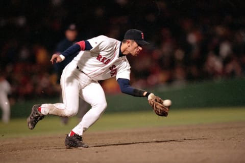 18 Oct 1999: Shortstop Nomar Garciaparra #5 of the Boston Red Sox scoops up the ball during Game 6 of the American League Championship Series against the New York Yankees at Fenway Park in Boston, Massachusetts. The Yankees defeated the Red Sox 6-1. Mandatory Credit: Doug Pensinger/Allsport