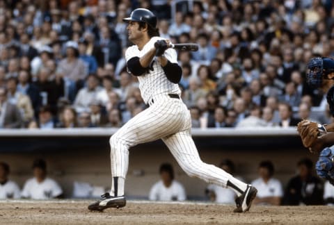 NEW YORK – CIRCA 1978: Lou Piniella #14 of the New York Yankees swings and watches the flight of his ball against the Kansas City Royals during a Major League Baseball game circa 1978 at Yankee Stadium in the Bronx borough of New York City. Piniella played for the Yankees from 1974-84. (Photo by Focus on Sport/Getty Images)