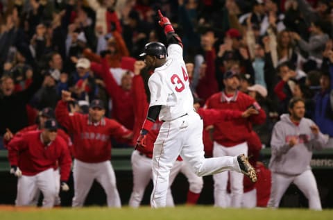 BOSTON – OCTOBER 17: David Ortiz #34 celebrates after hitting the game winning two-run home run against the New York Yankees in the twelfth inning during game four of the American League Championship Series on October 17, 2004 at Fenway Park in Boston, Massachusetts. (Photo by Jed Jacobsohn/Getty Images)