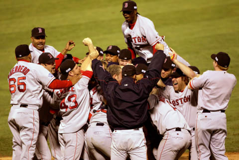 ST LOUIS – OCTOBER 27: The Boston Red Sox celebrate after defeating the St. Louis Cardinals 3-0 to win game four of the World Series on October 27, 2004 at Busch Stadium in St. Louis, Missouri. (Photo by Stephen Dunn/Getty Images)