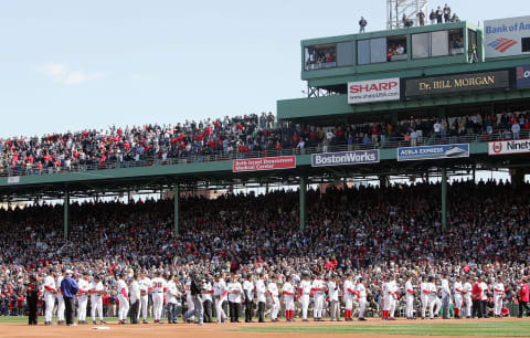 BOSTON, MA – APRIL 11: Members of the Boston Red Sox line up after receiving their World Series rings before playing the New York Yankees at Fenway Park on April 11, 2005 in Boston, Massachusetts. (Photo by Jim McIsaac/Getty Images)