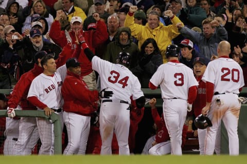 BOSTON – MAY 01: David Ortiz #34 of the Boston Red Sox is greeted at the dugout after his three run home run against the New York Yankees during their game at Fenway Park on May 1, 2006 in Boston, Massachusetts. (Photo by Jim McIsaac/Getty Images)