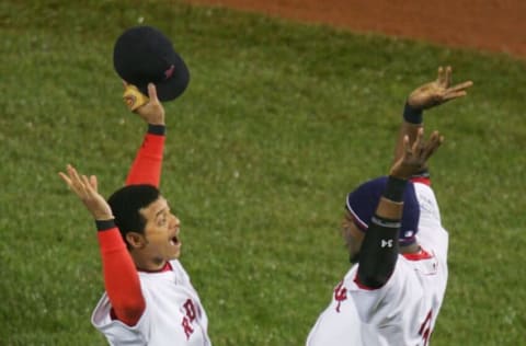 BOSTON – OCTOBER 24: Orlando Cabrera #44 and David Ortiz #34 of the Boston Red Sox celebrate after defeating the St. Louis Cardinals 6-2 in game two of the World Series on October 24, 2004 at Fenway Park in Boston, Massachusetts. The Boston Red Sox defeated the St. Louis Cardinals 6-2 to take a 2-0 game lead. (Photo by Al Bello/Getty Images)