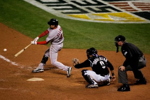 DENVER – OCTOBER 27: Jacob Ellsbury #46 of the Boston Red Sox hits a RBI double in the top of the eighth inning against the Colorado Rockies during Game Three of the 2007 Major League Baseball World Series at Coors Field on October 27, 2007 in Denver, Colorado. (Photo by Jeff Gross/Getty Images)