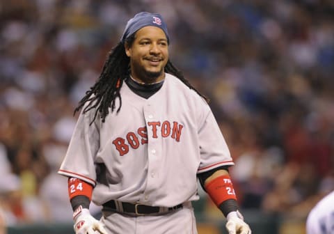 ST PETERSBURG, FL – July 2: Designated hitter Manny Ramirez #24 of the Boston Red Sox smiles after ducking from an inside pitch against the Tampa Bay Rays July 2, 2008 at Tropicana Field in St. Petersburg, Florida. (Photo by Al Messerschmidt/Getty Images)