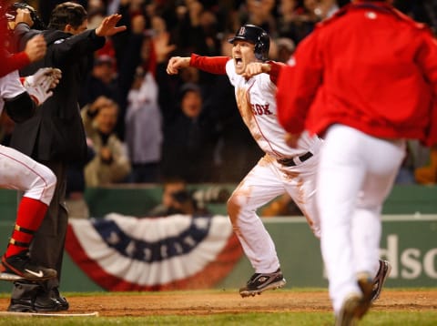 BOSTON – OCTOBER 6: Jason Bay #44 of the Boston Red Sox celebrates after scoring the winning run against the Los Angeles Angels of Anaheim for the American League Division Series at Fenway Park on October 6, 2008 in Boston, Massachusetts. (Photo by Jim Rogash/Getty Images)