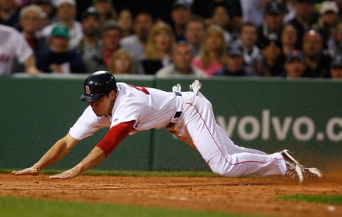 BOSTON – APRIL 26: Jacoby Ellsbury #46 of the Boston Red Sox steals home by Jorge Posada #20 of the New York Yankees at Fenway Park April 26, 2009 in Boston, Massachusetts. Jacoby Ellsbury recorded the first steal of home by a Red Sox player in 10 years. (Photo by Jim Rogash/Getty Images)