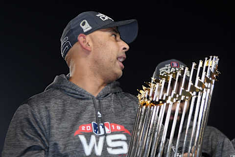 LOS ANGELES, CA – OCTOBER 28: Manager Alex Cora #20 of the Boston Red Sox celebrates with the World Series trophy after his team’s 5-1 win over the Los Angeles Dodgers in Game Five to win the 2018 World Series at Dodger Stadium on October 28, 2018 in Los Angeles, California. (Photo by Harry How/Getty Images)