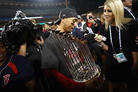 LOS ANGELES, CA – OCTOBER 28: Mookie Betts #50 of the Boston Red Sox celebrates with the World Series trophy after his team’s 5-1 win over the Los Angeles Dodgers in Game Five of the 2018 World Series at Dodger Stadium on October 28, 2018 in Los Angeles, California. (Photo by Ezra Shaw/Getty Images)