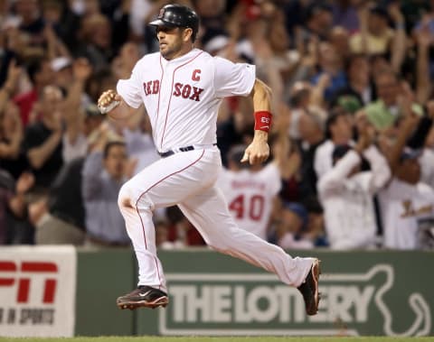 BOSTON, MA – AUGUST 31: Jason Varitek #33 of the Boston Red Sox heads for home after Jacoby Ellsbury hit a home run in the sixth inning against the New York Yankees on August 31, 2011 at Fenway Park in Boston, Massachusetts. (Photo by Elsa/Getty Images)