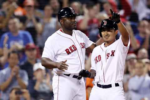 BOSTON, MA – SEPTEMBER 26: Tzu-Wei Lin #30 of the Boston Red Sox celebrates with third base coach Carlos Febles after hitting a triple against the Baltimore Orioles during the fourth inning at Fenway Park on September 26, 2018, in Boston, Massachusetts. (Photo by Maddie Meyer/Getty Images)