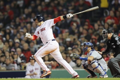 BOSTON, MA – OCTOBER 23: J.D. Martinez #28 of the Boston Red Sox hits an RBI double during the third inning against the Los Angeles Dodgers in Game One of the 2018 World Series at Fenway Park on October 23, 2018 in Boston, Massachusetts. (Photo by Elsa/Getty Images)