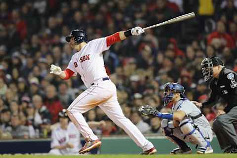 BOSTON, MA – OCTOBER 23: J.D. Martinez #28 of the Boston Red Sox hits an RBI double during the third inning against the Los Angeles Dodgers in Game One of the 2018 World Series at Fenway Park on October 23, 2018 in Boston, Massachusetts. (Photo by Elsa/Getty Images)